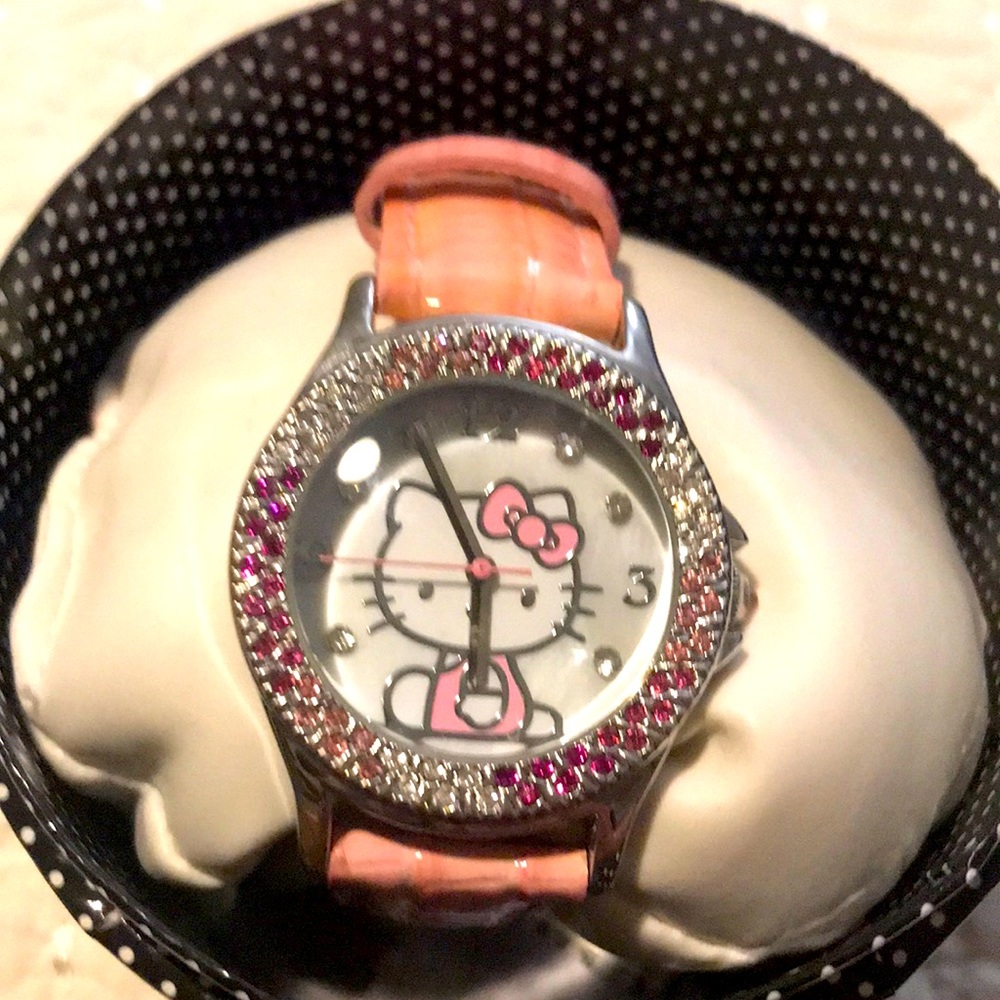 Hello kitty watch by Sanrio.  Beautiful cubic zirconia detail around the face.